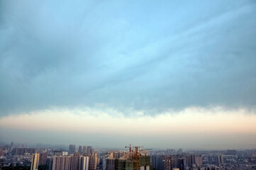 timelapse of clouds over city