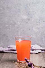 Orange juice drink mixed with mixed fruit in a clear glass