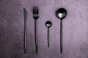 Clean black metal cutlery