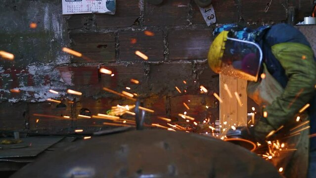 Worker polishing in metal industry