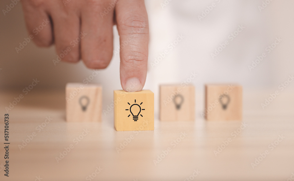 Poster hand pick wooden blocks with thinking and idea icon. concept for creative and design solution.