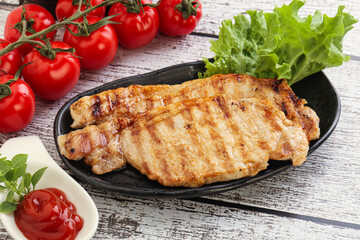 Grilled pork steak with ketchup
