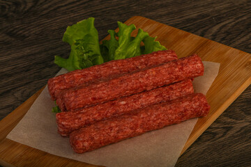 Raw beef sausages with spices