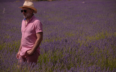 Adult man in hat on lavender fields. Brihuega, Spain