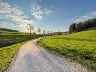 Bavarian Landscape with road to nowhere and blue sky background