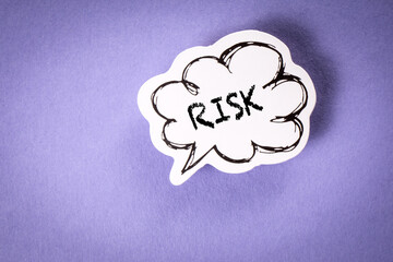 RISK concept. Speech bubble with text on purple background