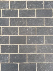 グレー色のレンガ壁の背景テクスチャ