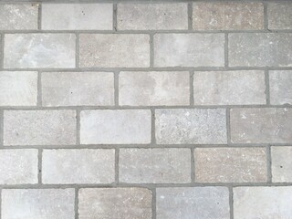 グレー色のレンガ壁の背景テクスチャ