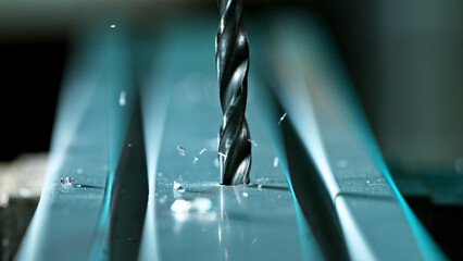 Drilling aluminium tube, close-up.