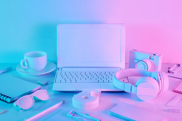 Office table with notebook computer and school supplies in vibrant gradient holographic neon colors. Concept art. Minimal office surrealism.