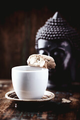 Cantuccini (Italian cookie) and a Cup of coffee on rustic wooden background. Close up. Copy space.