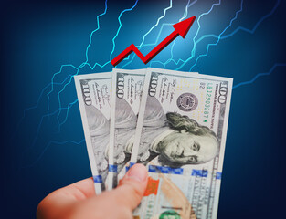 Inflation, dollar hyperinflation in the USA. Three of 100 dollar bills in woman hand on blue color...