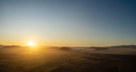 Fototapeta na wymiar A panoramic shot of the Namib Desert in Namibia while a early morning Hot-Air Ballon ride. 