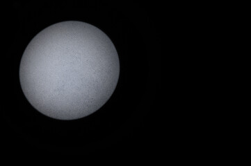 Gray Textured Background. Black Background with Round Beam of Light on Left Side. Copy Space.