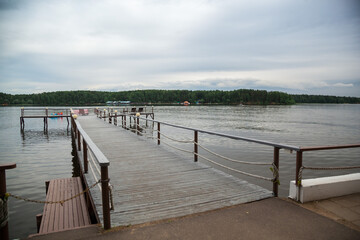 Wooden pier on the lake in summer.