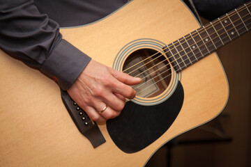 Man playing guitar, Close-up shot.