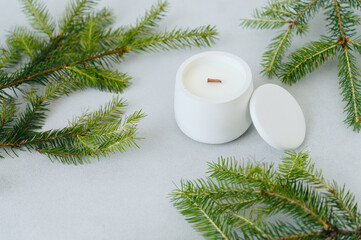 White candle in Gypsum flowerpot close-up. Candle Handmade, Minimalism.