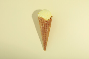 Cone of ice cream on beige background