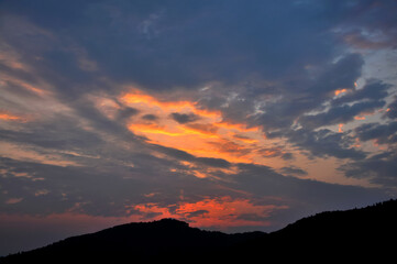 sun ray is go down and amazing dramatic orange cloud