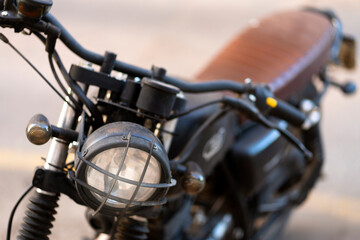 Fototapeta na wymiar Closeup of vintage black custom motorcycle, selective focus 