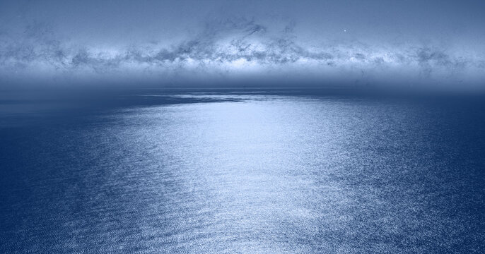 Milkyway rise above calm sea with waves "Elements of this image furnished by NASA"