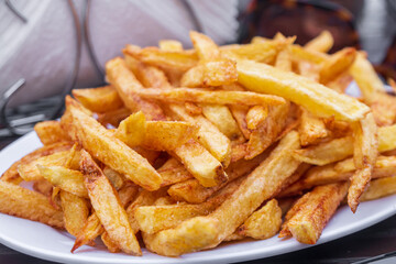 Hot fresh French fries snack in the plate