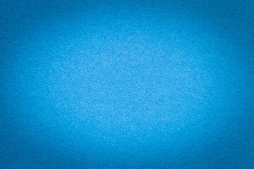 Texture of vintage light blue paper gradient background with dark vignette. Structure of craft...