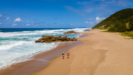 St Lucia South Africa, men and woman walking at the beach Mission Rocks beach near Cape Vidal in...