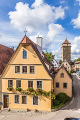 Fototapeta premium Rothenburg ob der Tauber, Germany. Fortress tower and old houses next to the city wall