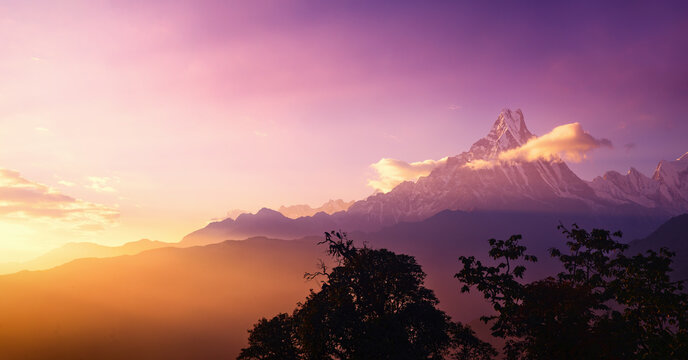 Scenic panoramic view landscape with mountain peak Machapuchare, Nepal on sunrise.