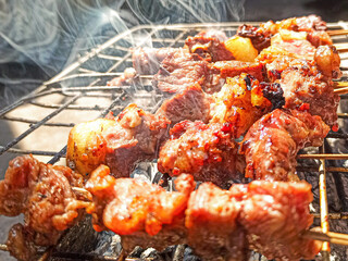 Beef satay grilled over hot coals with a savory soy sauce