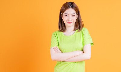 Obraz premium Photo of young Asian girl posing on background