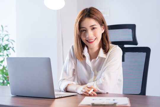 Portrait of young Asian businesswoman working