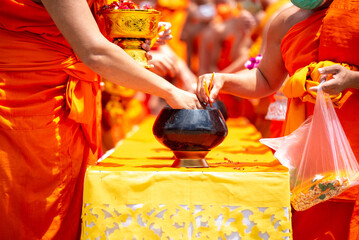 Offering alms to monks and offering candles Bring a candle to offer to the only monk in Thailand,...