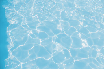 The surface of the blue pool, the background of the water in the pool. Wavy pool water surface, Blue ribbed pool water