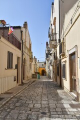 A street between the old houses of Ferrandina, a rural village in the Basilicata region, Italy.
