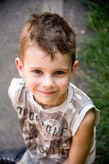 portrait of smiling happy child in forest