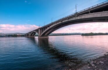 Fototapeta na wymiar bridge over the river at sunset