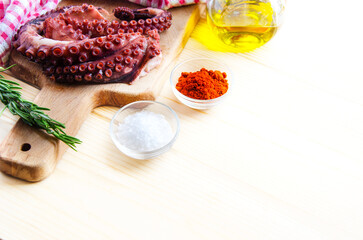 Ingridients fo making calician style octopus o pulpo a la gallega on light table. Copy spaced