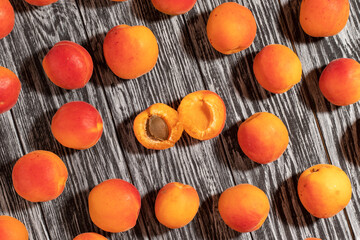 Ripe apricots on a wooden table.