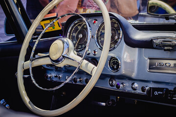 Classic vintage car wheel and dashboard