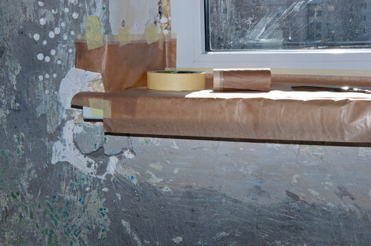 Windowsill and grunge cement walls prepared for home remodeling, renovations