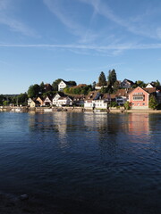 Fototapeta na wymiar Cute Rhine River in STEIN AM RHEIN town in SWITZERLAND - vertical