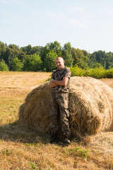 farmer with hay bales