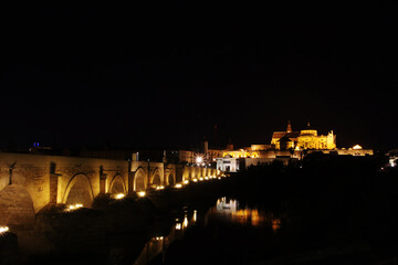 The night view of the Roman bridge in Cordoba, Spain