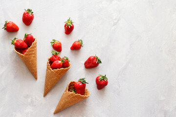 Fresh strawberries in waffle cones. Summertime mood. Flat lay, top view