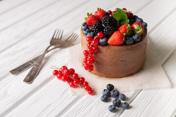Chocolate cake with fresh different berries