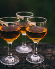 Three glasses of Georgian dry wine close up on the background of mountains. Rest, gourmets, incredible taste, white home wine