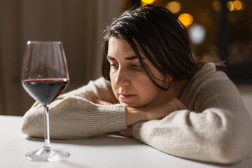 alcoholism, alcohol addiction and people concept - drunk woman or female alcoholic drinking red...