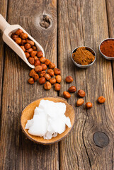 hazelnut cream ingredients on old wooden table